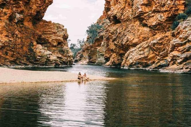 Two people next to West Macs waterhole